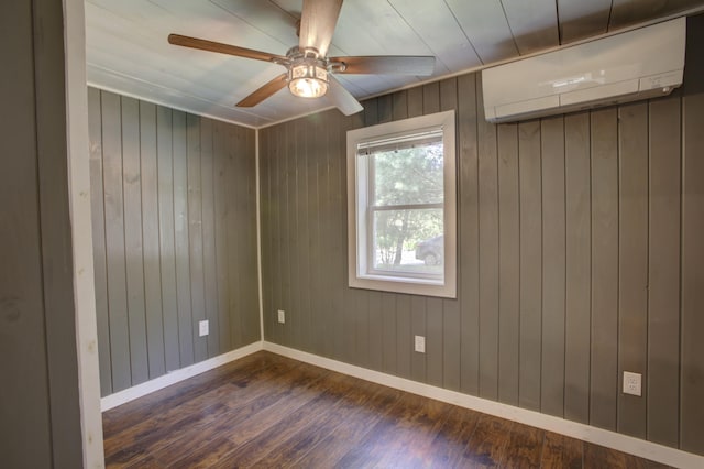 6 Meadow Ln, Sabattus, ME 04280 - unfurnished room featuring a wall mounted AC, dark wood-style flooring, a ceiling fan, and wooden walls
