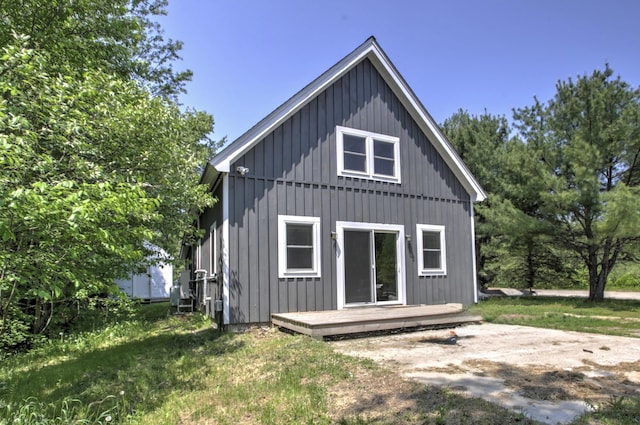 6 Meadow Ln, Sabattus, ME 04280 - rear view of property featuring board and batten siding and a wooden deck