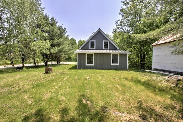 6 Meadow Ln, Sabattus, ME 04280 - rear view of property with a metal roof, a standing seam roof, and a yard