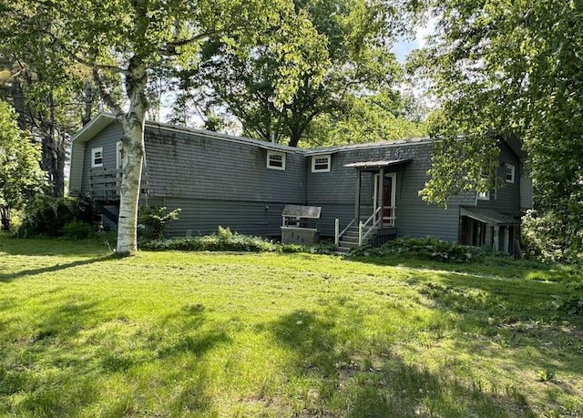 235 S Reynolds Rd, Winslow, ME 04901 - rear view of house featuring a lawn and entry steps