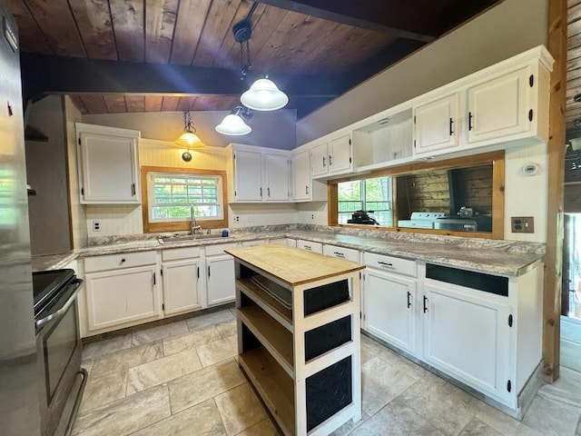 235 S Reynolds Rd, Winslow, ME 04901 - kitchen featuring stainless steel range with electric stovetop, wood ceiling, plenty of natural light, and white cabinets