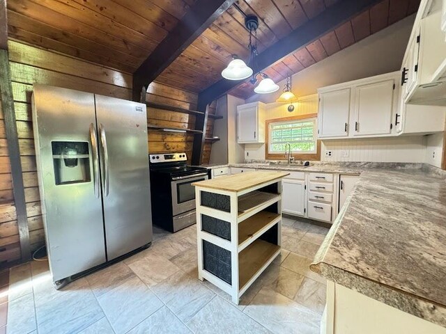 235 S Reynolds Rd, Winslow, ME 04901 - kitchen featuring stainless steel appliances, open shelves, a wood ceiling with exposed beams, wood walls, and white cabinetry