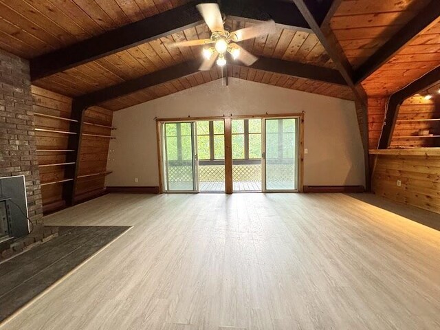 235 S Reynolds Rd, Winslow, ME 04901 - unfurnished living room with ceiling fan, wood finished floors, wooden ceiling, a brick fireplace, and wood walls