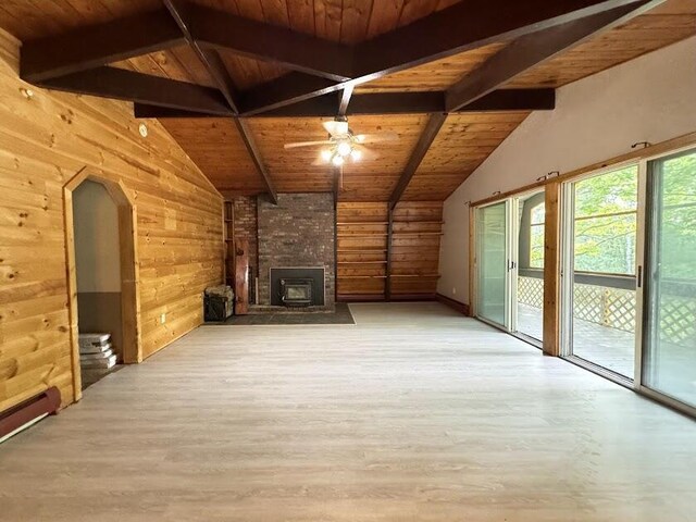 235 S Reynolds Rd, Winslow, ME 04901 - unfurnished living room featuring wooden ceiling, wood walls, wood finished floors, a ceiling fan, and a large fireplace