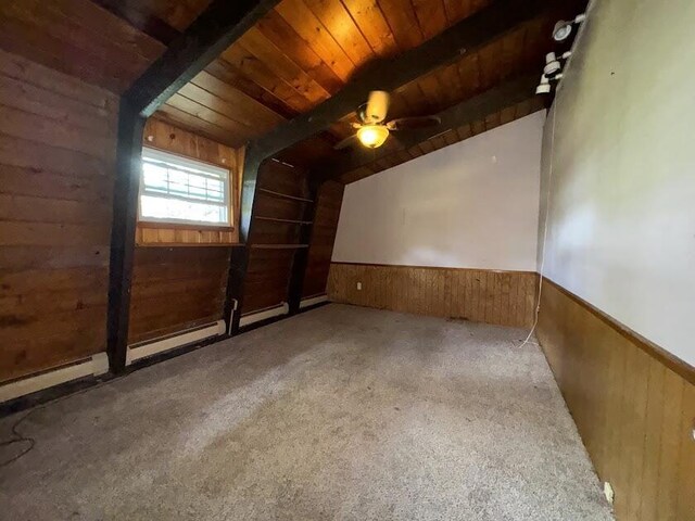 235 S Reynolds Rd, Winslow, ME 04901 - unfurnished room with wood walls, a wooden ceiling with exposed beams, a wainscoted wall, a ceiling fan, and carpet floors