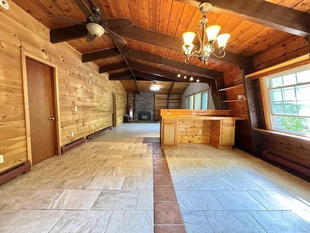 235 S Reynolds Rd, Winslow, ME 04901 - unfurnished living room featuring wooden ceiling, ceiling fan, wooden walls, stone tile flooring, and a chandelier