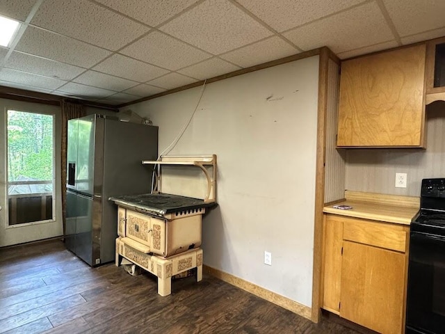 235 S Reynolds Rd, Winslow, ME 04901 - kitchen with black range with electric stovetop, stainless steel refrigerator with ice dispenser, dark wood finished floors, light countertops, and a paneled ceiling