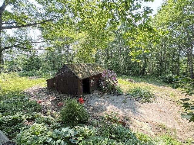 235 S Reynolds Rd, Winslow, ME 04901 - view of yard featuring a storage shed and a view of trees
