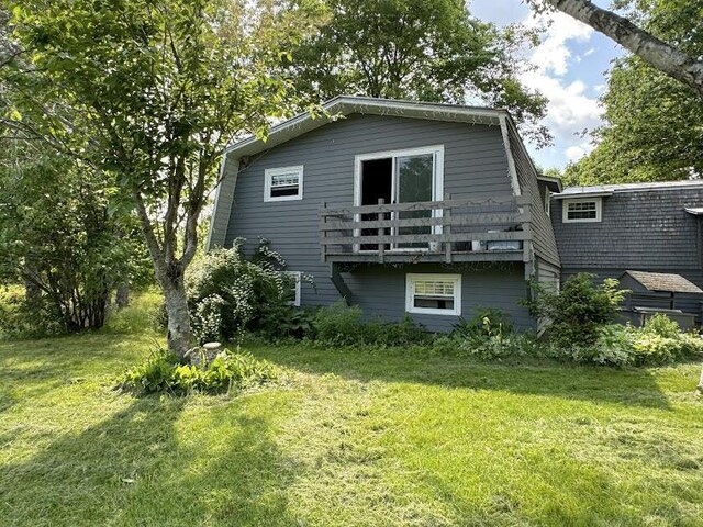235 S Reynolds Rd, Winslow, ME 04901 - rear view of house with a gambrel roof and a yard