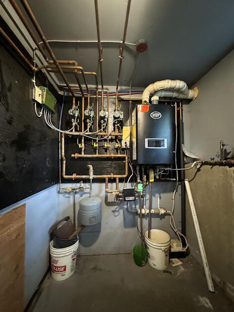 235 S Reynolds Rd, Winslow, ME 04901 - utility room with water heater