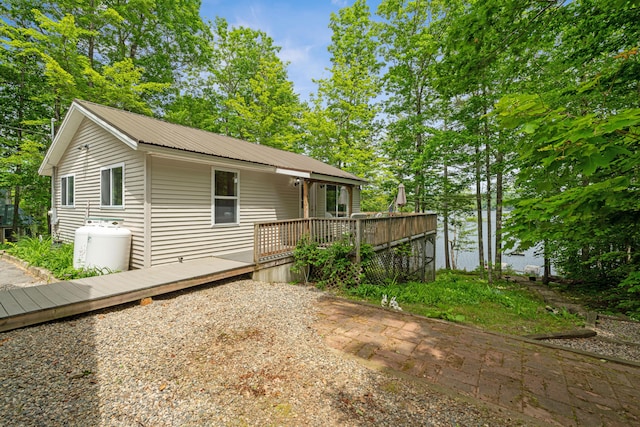 204 Youngs Ridge Rd, Acton, ME 04001 - view of front of home featuring a wooden deck and a metal roof