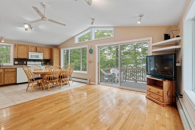 204 Youngs Ridge Rd, Acton, ME 04001 - dining area featuring baseboard heating, light wood-style flooring, lofted ceiling, and ceiling fan