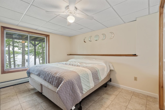 204 Youngs Ridge Rd, Acton, ME 04001 - tiled bedroom with a paneled ceiling, a baseboard heating unit, and a ceiling fan