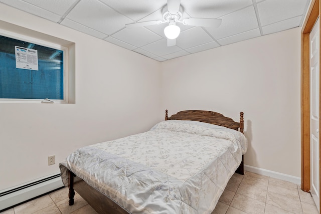 204 Youngs Ridge Rd, Acton, ME 04001 - tiled bedroom featuring a baseboard radiator, a paneled ceiling, and ceiling fan