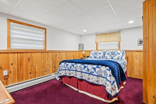 182 Myrtle St, Westbrook, ME 04092 - carpeted bedroom featuring a baseboard heating unit, a wainscoted wall, a drop ceiling, wooden walls, and recessed lighting