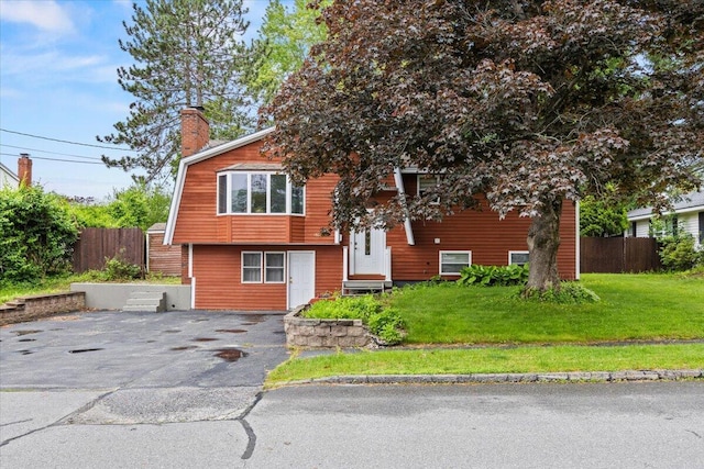 182 Myrtle St, Westbrook, ME 04092 - view of front of home featuring a chimney and asphalt driveway