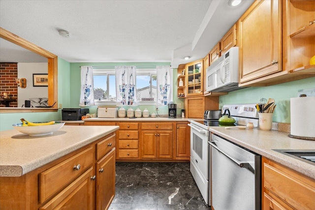 182 Myrtle St, Westbrook, ME 04092 - kitchen with white appliances, dark marble finish floors, and light countertops