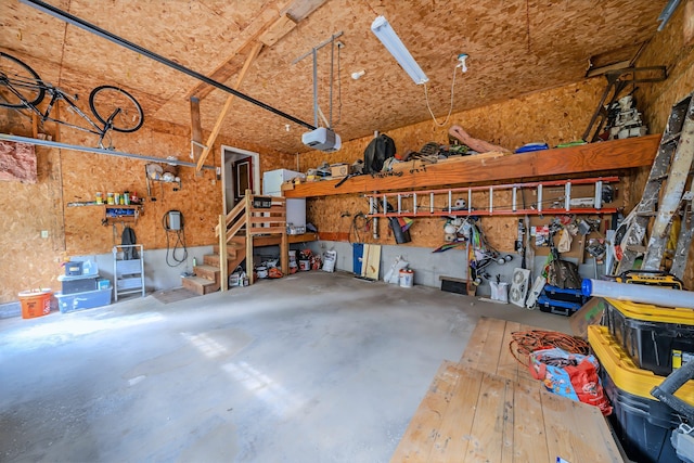82 Eaton Ridge Dr, Holden, ME 04429 - garage with a garage door opener and a workshop area