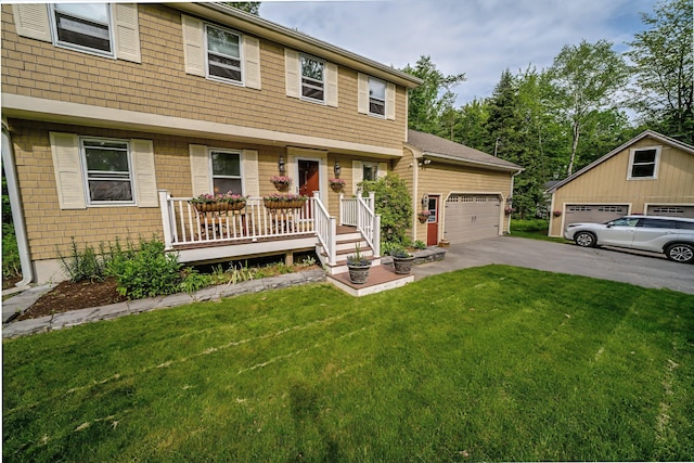 82 Eaton Ridge Dr, Holden, ME 04429 - colonial-style house with a front lawn, covered porch, and a garage