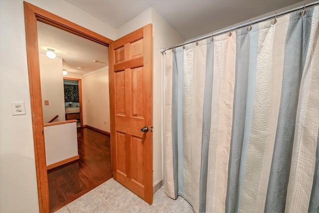 82 Eaton Ridge Dr, Holden, ME 04429 - full bathroom featuring wood finished floors and a shower with curtain