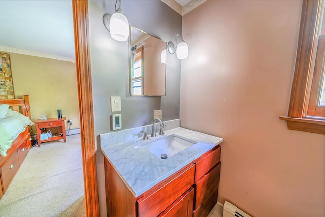 82 Eaton Ridge Dr, Holden, ME 04429 - bathroom with vanity, a baseboard heating unit, crown molding, and baseboard heating