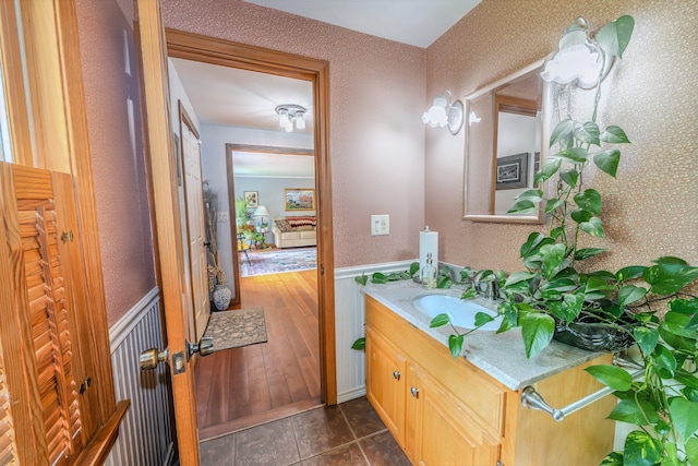 82 Eaton Ridge Dr, Holden, ME 04429 - bathroom featuring vanity, wainscoting, and tile patterned floors