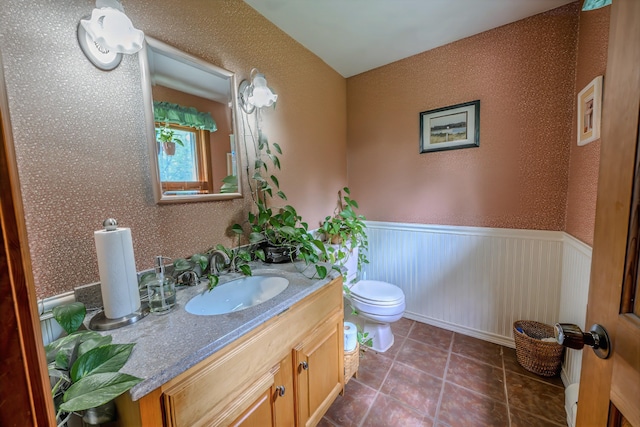 82 Eaton Ridge Dr, Holden, ME 04429 - bathroom featuring vanity, wainscoting, and tile patterned flooring