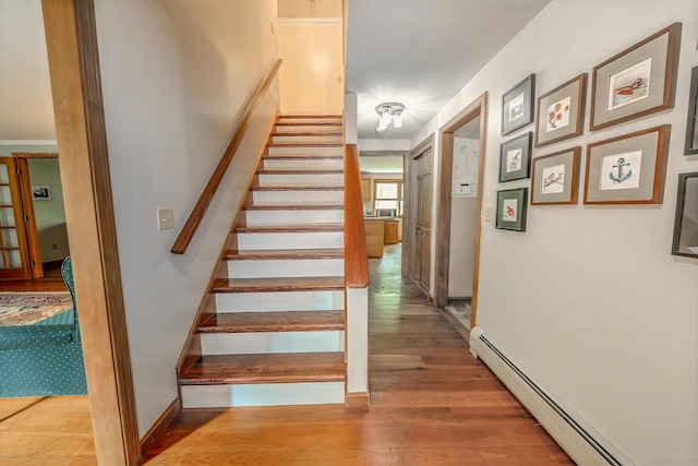 82 Eaton Ridge Dr, Holden, ME 04429 - stairway with a baseboard radiator and wood finished floors
