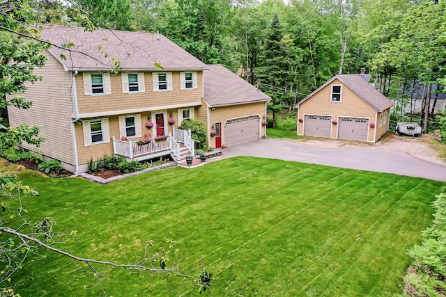 82 Eaton Ridge Dr, Holden, ME 04429 - colonial house with a front yard, a shingled roof, and an outdoor structure
