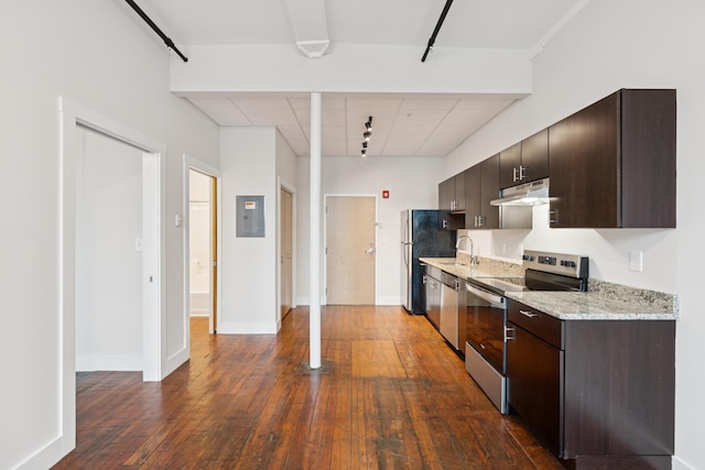 2 Main St Unit 17-415, Biddeford, ME 04005 - kitchen featuring appliances with stainless steel finishes, under cabinet range hood, dark wood-style flooring, electric panel, and dark brown cabinets