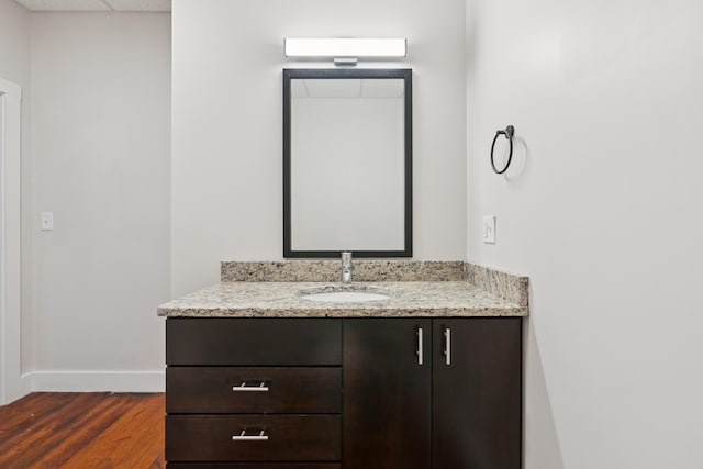 2 Main St Unit 17-415, Biddeford, ME 04005 - bathroom with vanity, wood finished floors, and a paneled ceiling