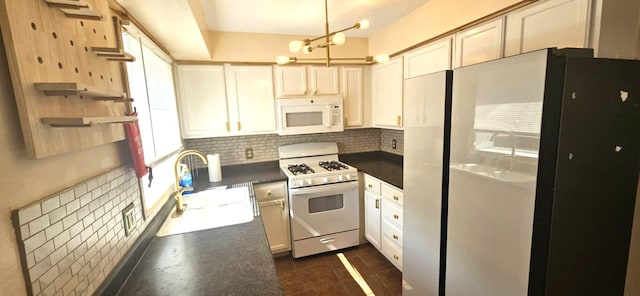 9 Hubbard Farms Rd Unit 15, Orono, ME 04473 - kitchen featuring white appliances, dark countertops, tasteful backsplash, a chandelier, and open shelves