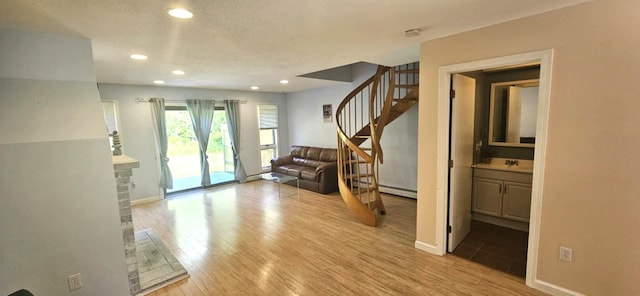 9 Hubbard Farms Rd Unit 15, Orono, ME 04473 - entrance foyer with stairs, recessed lighting, wood finished floors, and a textured ceiling