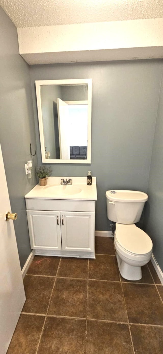 9 Hubbard Farms Rd Unit 15, Orono, ME 04473 - half bath with vanity, a textured ceiling, and tile patterned floors