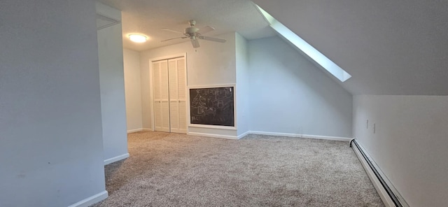 9 Hubbard Farms Rd Unit 15, Orono, ME 04473 - bonus room with baseboard heating, a skylight, ceiling fan, carpet, and lofted ceiling