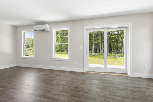 24 Varney Mill Rd Unit 3, Windham, ME 04062 - unfurnished room with a wall mounted air conditioner and dark wood finished floors