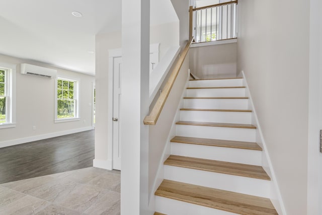 24 Varney Mill Rd Unit 3, Windham, ME 04062 - staircase featuring a wall unit AC and wood finished floors
