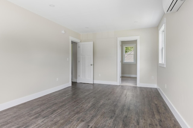 24 Varney Mill Rd Unit 3, Windham, ME 04062 - unfurnished room featuring an AC wall unit and dark wood-style floors