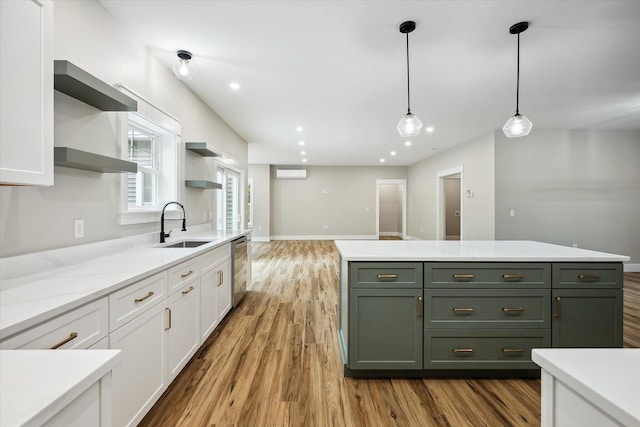 18 Crestwood Dr, Orrington, ME 04474 - kitchen featuring open shelves, white cabinets, light wood-type flooring, hanging light fixtures, and stainless steel dishwasher