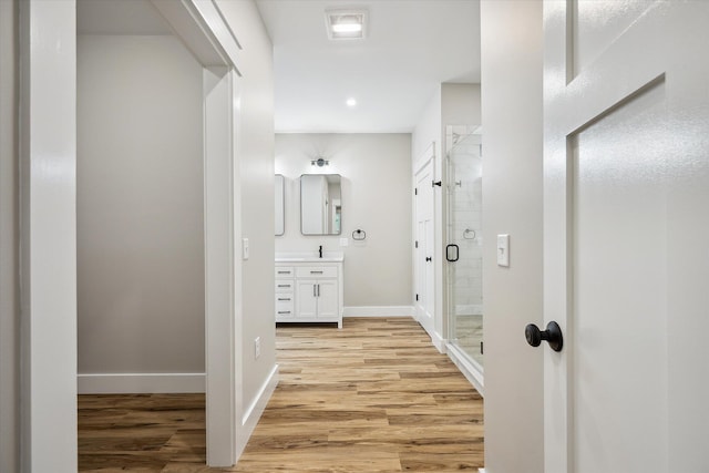 18 Crestwood Dr, Orrington, ME 04474 - bathroom with wood finished floors, vanity, a stall shower, and recessed lighting