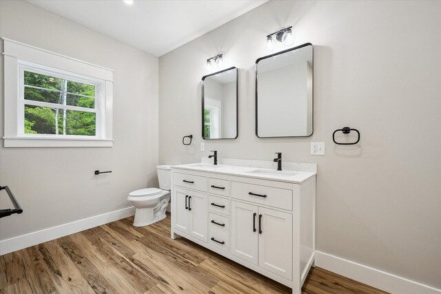 18 Crestwood Dr, Orrington, ME 04474 - bathroom featuring double vanity and wood finished floors