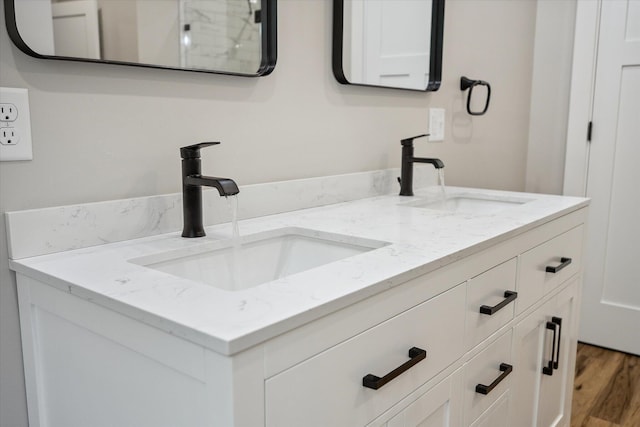 18 Crestwood Dr, Orrington, ME 04474 - bathroom featuring double vanity and wood finished floors