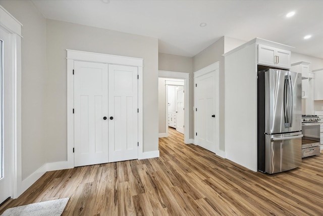 18 Crestwood Dr, Orrington, ME 04474 - kitchen featuring stainless steel appliances, light wood-type flooring, white cabinets, recessed lighting, and light countertops