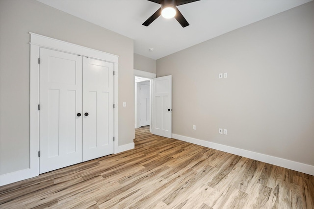 18 Crestwood Dr, Orrington, ME 04474 - unfurnished bedroom featuring light wood-style flooring, a closet, and ceiling fan