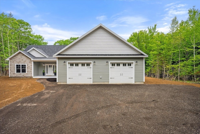 18 Crestwood Dr, Orrington, ME 04474 - single story home featuring a shingled roof and a porch