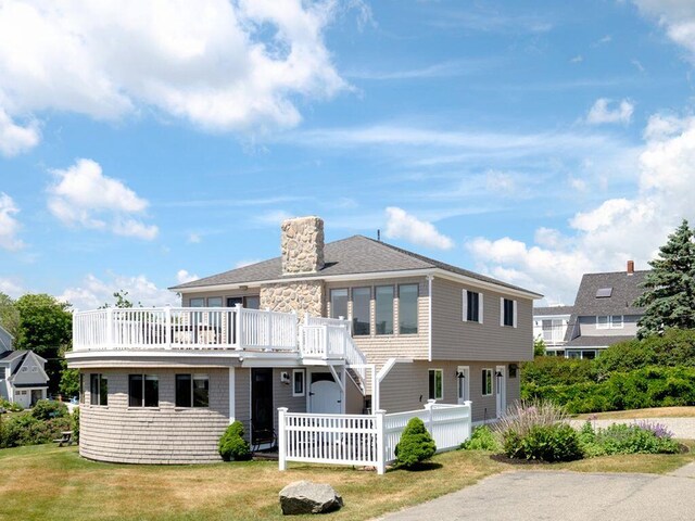 265 Nubble Rd, York, ME 03909 - view of front of house with a chimney, stairs, a wooden deck, and stone siding