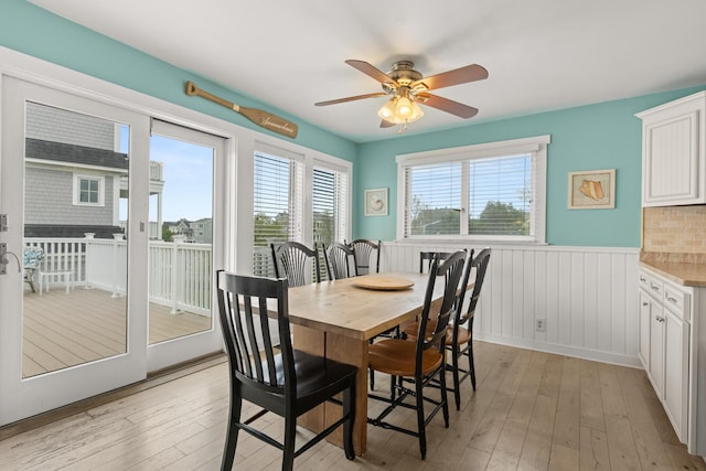 265 Nubble Rd, York, ME 03909 - dining space featuring wainscoting, light wood finished floors, and ceiling fan