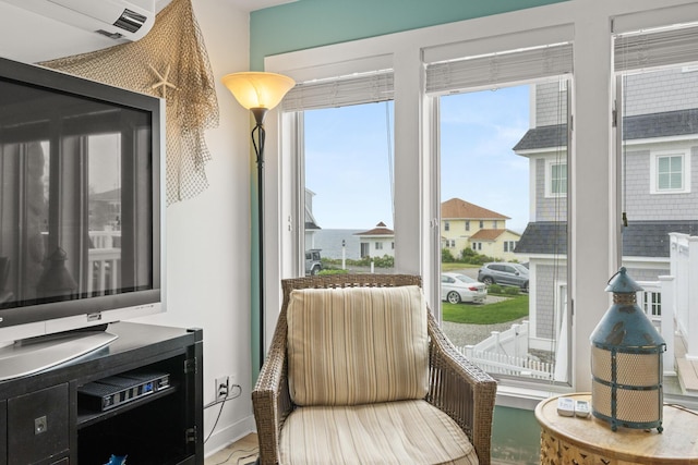 265 Nubble Rd, York, ME 03909 - sitting room featuring a wall mounted air conditioner and baseboards