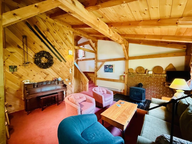 705 Webber St Unit 3, Carrabassett Valley, ME 04947 - carpeted living area featuring a baseboard radiator, a wood stove, wooden ceiling, wooden walls, and stairs