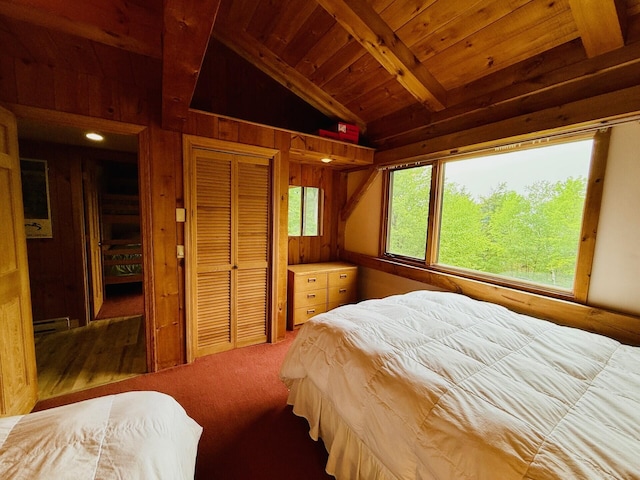 705 Webber St Unit 3, Carrabassett Valley, ME 04947 - bedroom with wooden ceiling, wood walls, and carpet floors